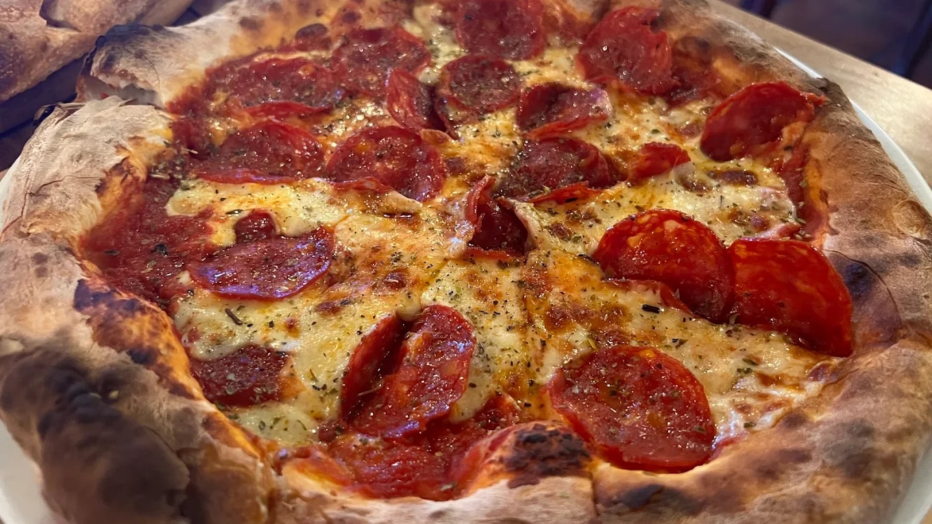 Their wood-fired pizzas are known for thin crusts and carefully layered toppings that capture true Italian flavor